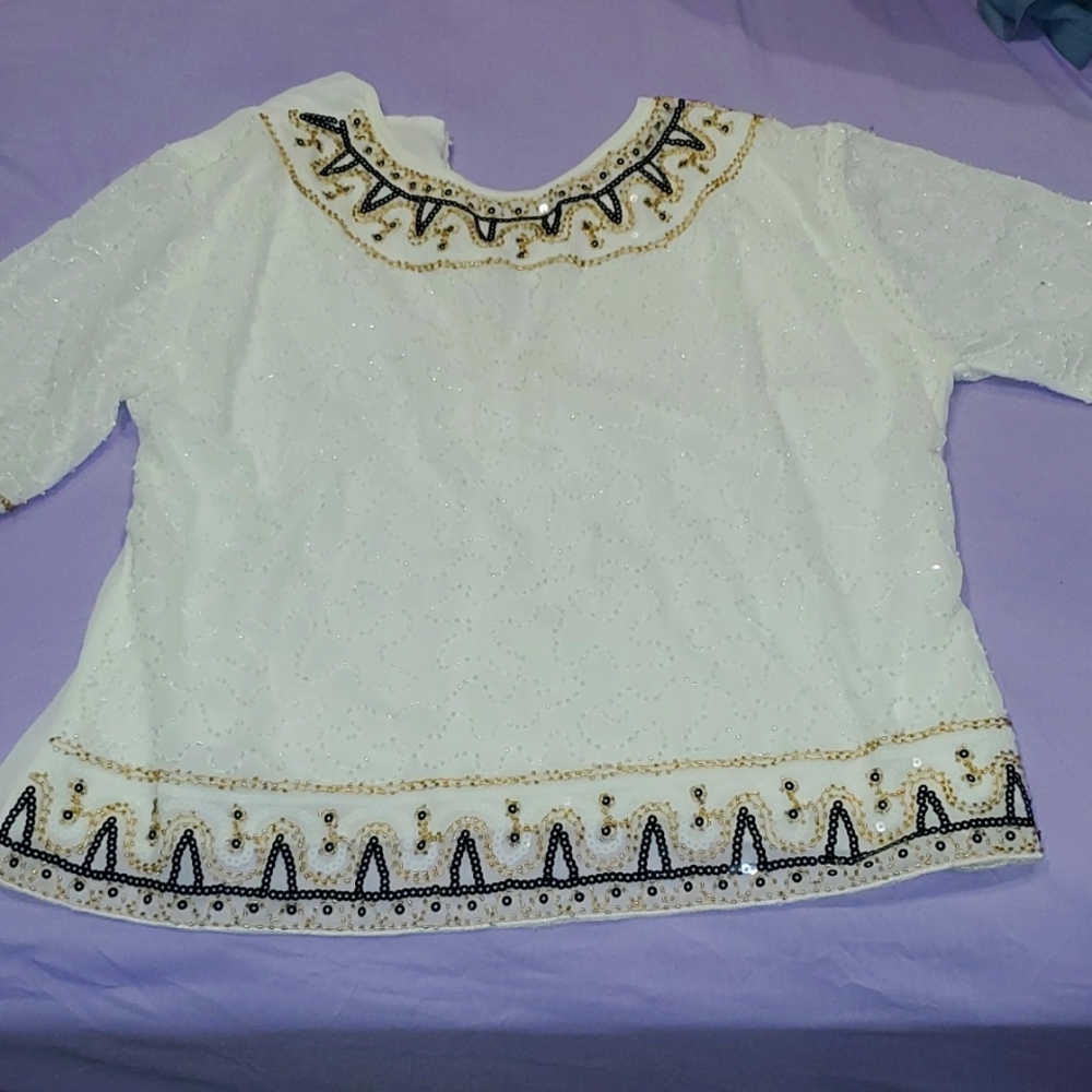 White top with pretty jems and lace work. Laced gem neckline short sleeves